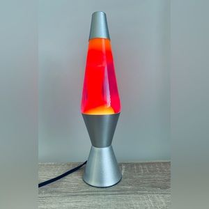 Retro lava lamp.  Silver base. Pinks and purples.